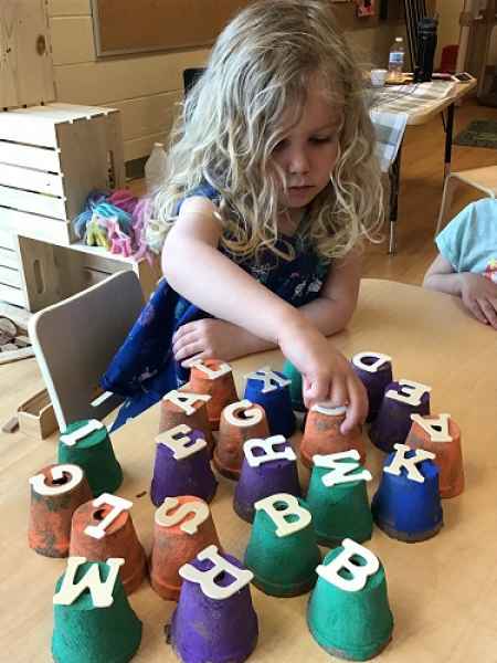 girl sorting letters